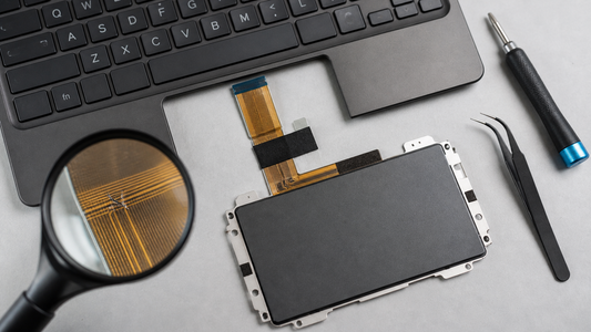 Simulated professional repair scene for Laptop Touchpad: Fractured flex-cable trace